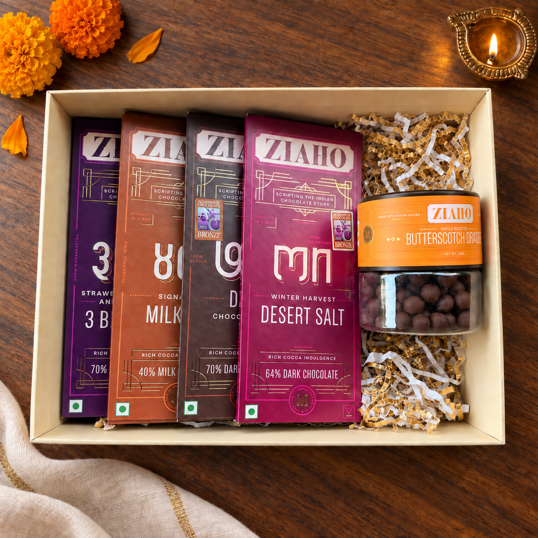 The Medal Selection open gift box with four chocolate bars and Butterscotch Dragees
